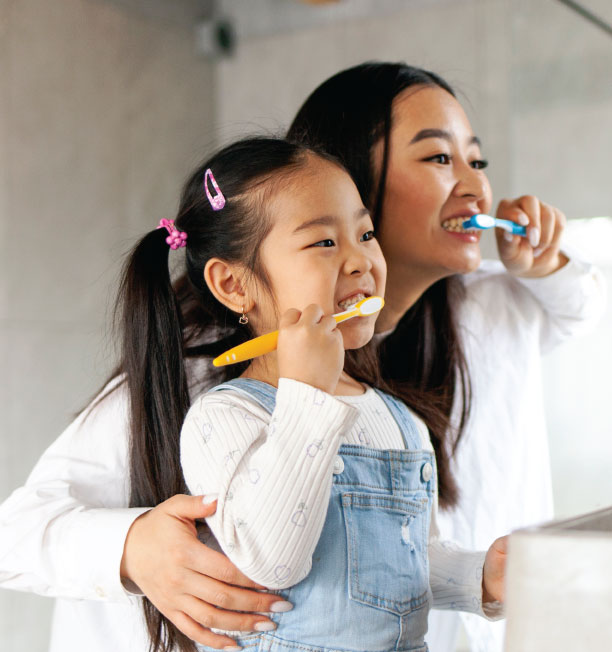 Family smiling at Reunion Dental Care